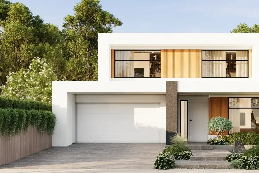 Modern two-storey white home with a double garage and a landscaped front garden